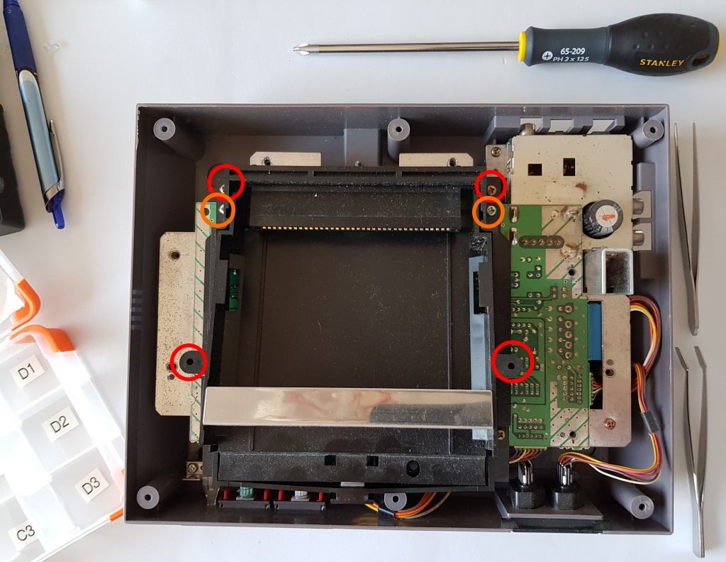 Screws holding cartridge slot 